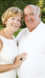 Photo of confident, smiling older couple