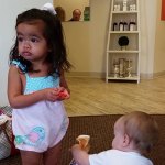 Photo of two young children, waiting for their dental visit with Dr. Andy