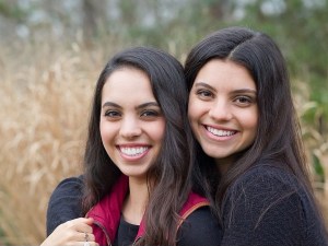 Photo of two teenaged girls, smiling with straight white teeth